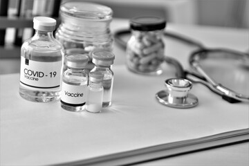 medicine vials and syringe , covid-19 concept