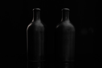 Still life with black bottles