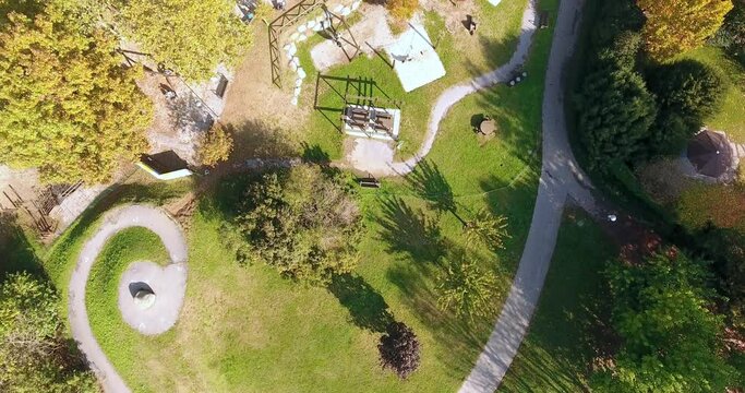 Bird-eye aerial over a city park in spring