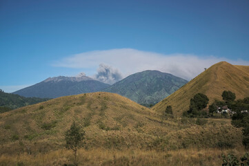 Fototapeta na wymiar Bondowoso, 26 July 2015 East Java / Indonesia Mount Raung eruption spews lava and ash, pictures taken from Savannah Wurung Crater (Kawah Wurung) during the dry season.
