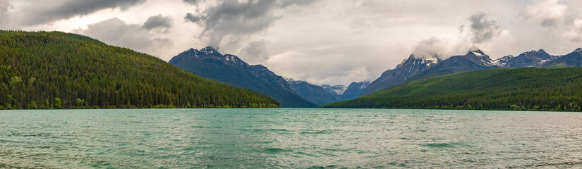 Panorama of Bowman Lake in Glacier National Park on cloudy day