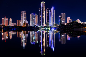 Fototapeta na wymiar Surfers Paradise cityscape reflections by night, view from Evandale parklands.