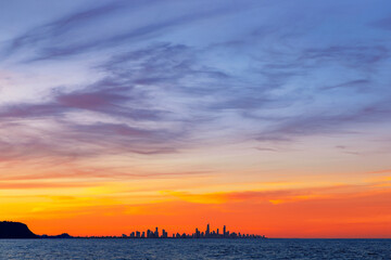 Colourful sunset view of Gold Coast cityscape, view from Currumbin Rock, Gold Coast