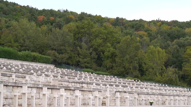 Hillside row of white small stone crosses at Polish cemetery at Monte Cassino, Italy, static