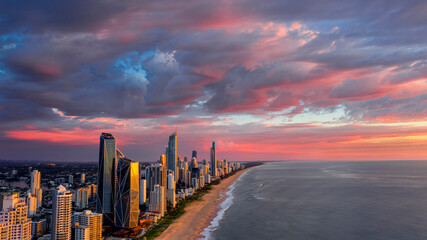Aerial view with pink clouds in the sky for sunrise over Surfers Paradise Gold Coast