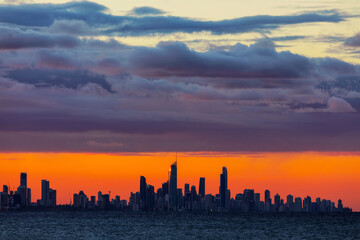 A large mass of stratus clouds hovering over Surfers Paradise cityscape at sunset