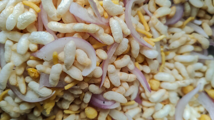 macro view of indian snacks with puffed rice corns