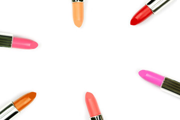 colorful lipsticks arrange on white background with middle copy space,beauty and makeup concept