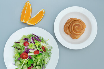 A plate of healthy and delicious salad and a bread