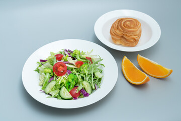 A plate of healthy and delicious salad and a bread