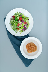 A plate of healthy and delicious salad and a bread