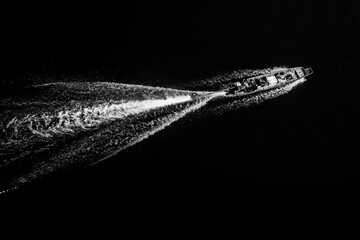 Black and white background of ship sails on river.