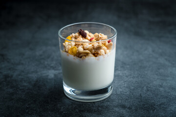 A cup of western-style breakfast oatmeal yogurt.A glass of western breakfast oatmeal milk