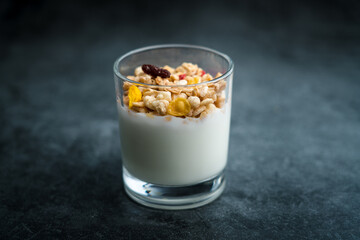 A cup of western-style breakfast oatmeal yogurt.A glass of western breakfast oatmeal milk