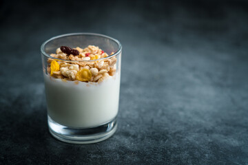 A cup of western-style breakfast oatmeal yogurt.A glass of western breakfast oatmeal milk