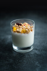 A cup of western-style breakfast oatmeal yogurt.A glass of western breakfast oatmeal milk