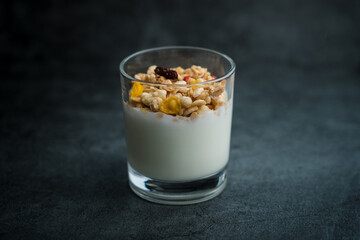 A cup of western-style breakfast oatmeal yogurt.A glass of western breakfast oatmeal milk