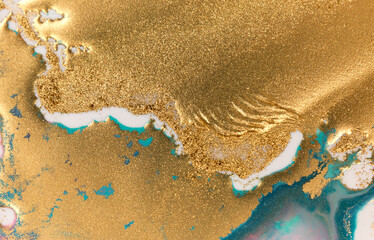 Golden glitter scattering background. Sparkling gold and blue texture.