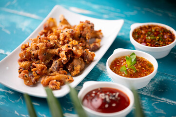 Crispy fried sliced belly pork with spicy sauce