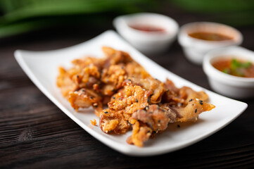 Crispy fried sliced belly pork with spicy sauce