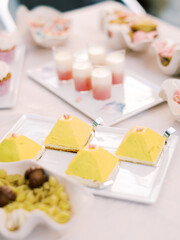 Iridescent mermaid party with beautiful floral, cake, balloon installation and desserts