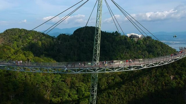 Establishing drone view of Langkawi Sky Bridge with cable cars in the background on Langkawi Island in Malaysia.