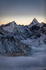 Mountains at dusk with last light on the peak. 