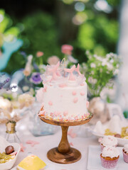 Iridescent mermaid party with beautiful floral, cake, balloon installation and desserts