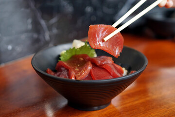 Akami Donburi - A rice bowl topped with tuna, served with wasabi, A japanese dish consisting of fish, meal, vegetable and served over rice.