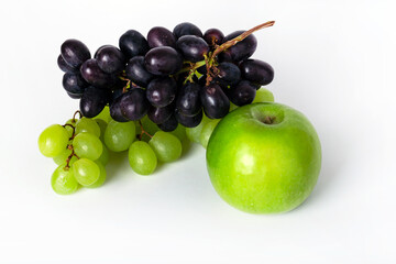 Bunch of green and blue grape and apple isolated on white background