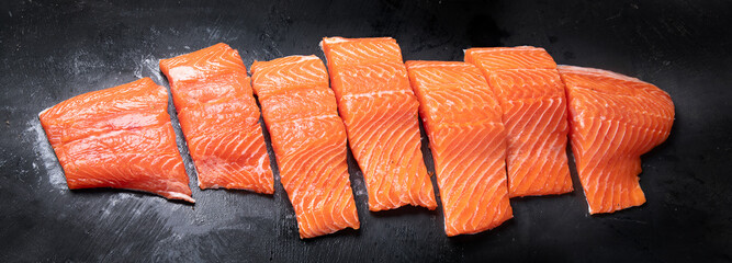 Fresh fish. Raw salmon on black background