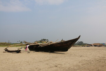 wooden boat on the beach of Goa