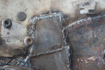 Welded metal. Welding a metal pipe. Welding machine concept