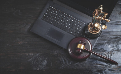  Statue of Lady Justice, gavel and laptop.