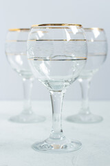 Crystal glasses with gold patterns. Selective focus