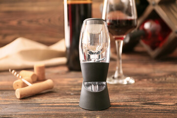 Wine aerator on wooden background