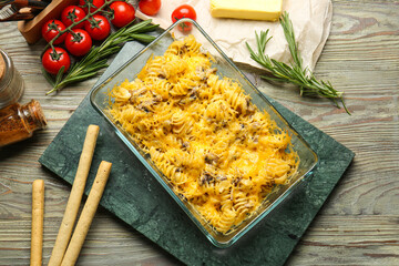 Tasty baked pasta in dish on table