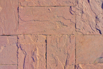 close up red sandstone brick wall tile surface texture background