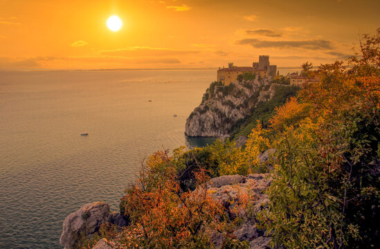Amazing sunset over Mediterranean Duino Castle. Italy.