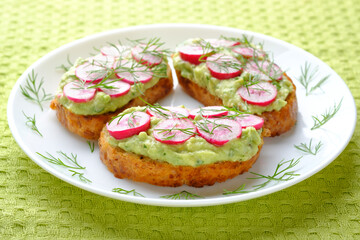Three delicious vegan sandwiches with radish and avocado. Horizontal orientation.