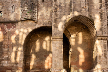 Ancient stonework and arches of an old historic building in the Gothic District of Barcelona