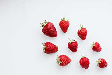 Ripe sweet strawberries on a white background