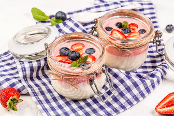 Close up panna cotta dessert with strawberries and blueberries. Food recipe background