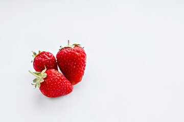 Ripe sweet strawberries on a white background