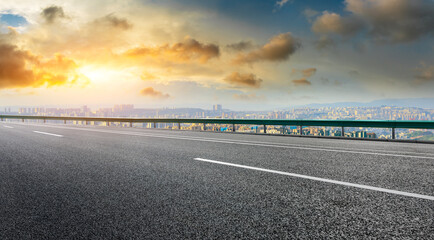 Fototapeta premium Empty asphalt road and chongqing skyline with buildings at sunset,China.