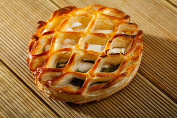 Tasty bakery pastries with goat cheese and and spinach