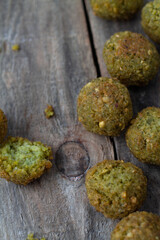 Falafel balls on a wooden background