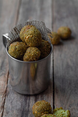 Falafel balls on a wooden background