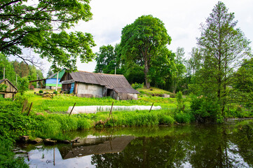 Old village house near the lake in summer. Minsk Belarus 22 June 2020