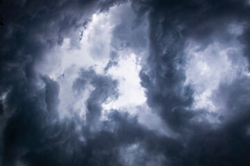 Naklejka na ściany i meble Scary beautiful storm clouds. Gloomy dark sky hurricane